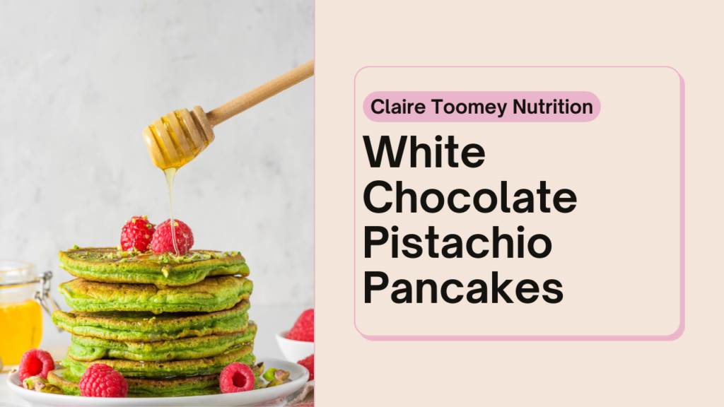 Image of pistachio coloured pancake stack with raspberries and honey. Text reads "White Chocolate Pistachio Pancakes"